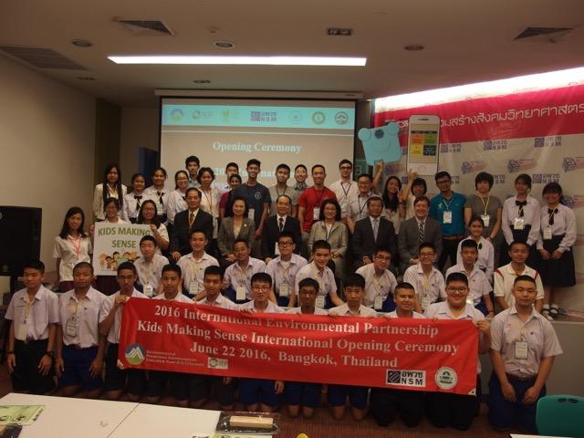 A large group of students standing in a class