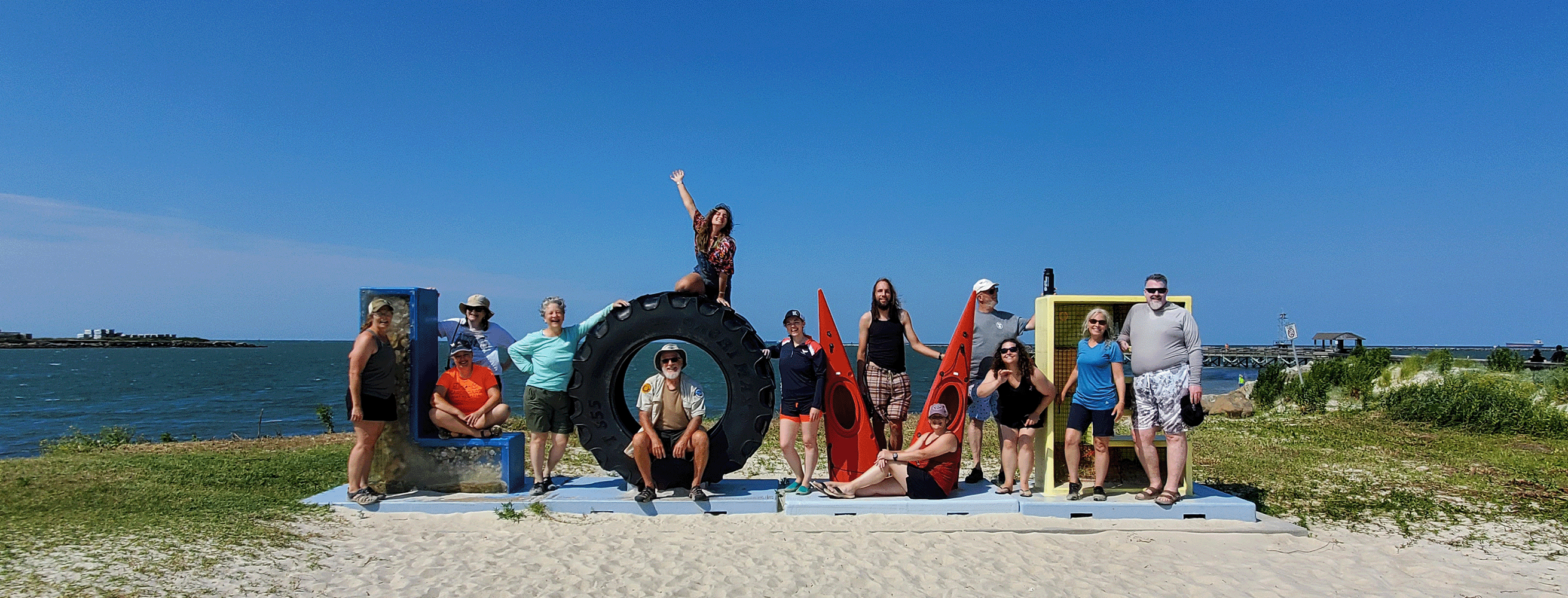 Certification Candidates at Virginia Love Sign on Beach