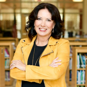 Maryland Delegate Michele Guyton wearing a yellow jacket smiling at the camera