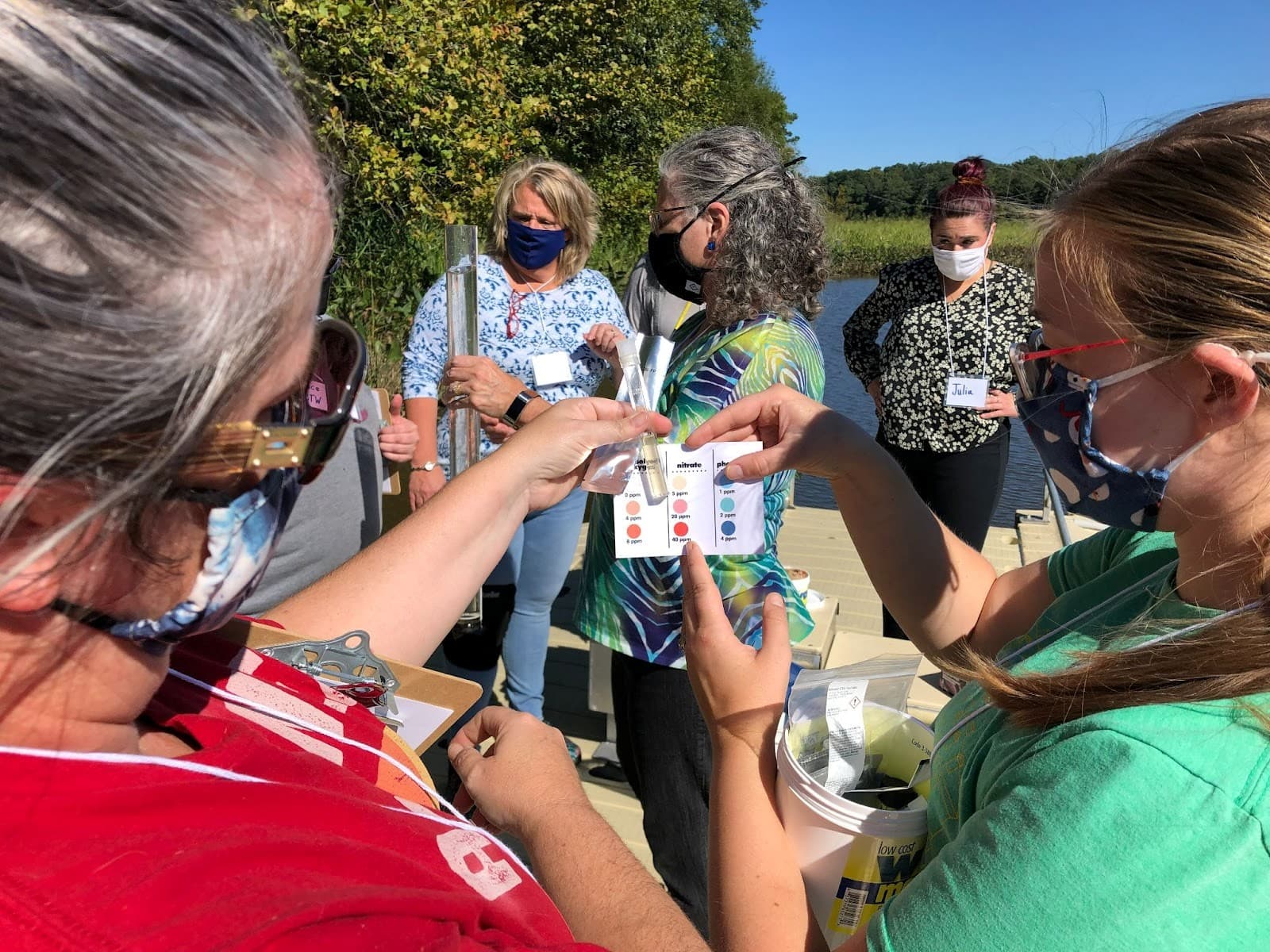 teachers and older students testing water