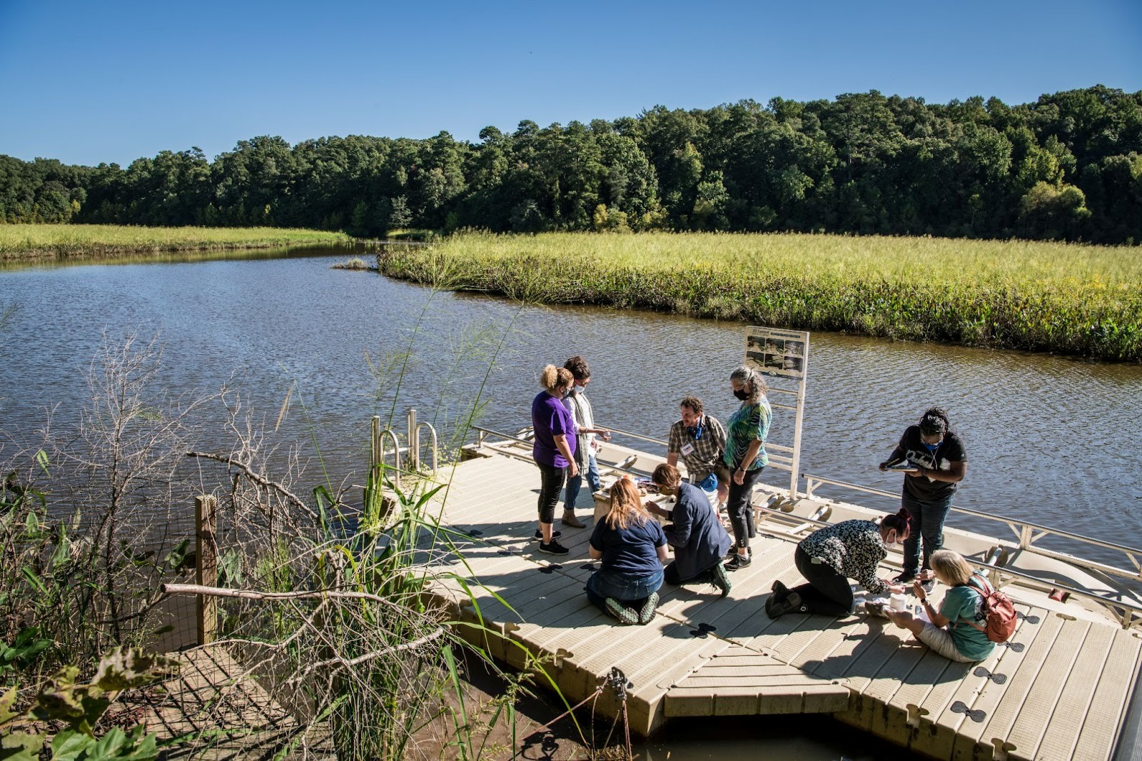 teachers on dock testing water quality