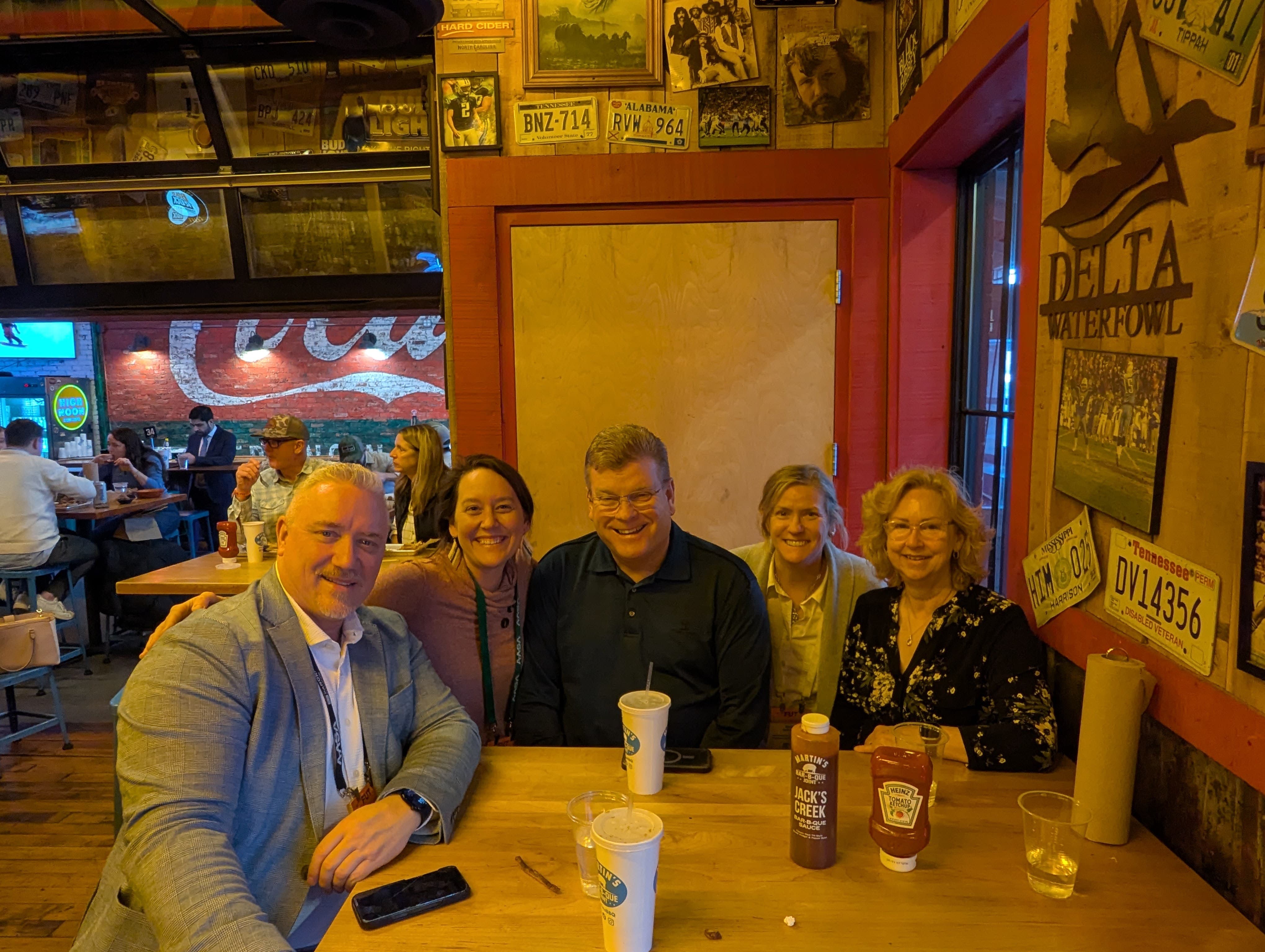 From left to right: Dr. Kevin Garinger, Horizon School Division, AB, Canada; Megan Fink; Kevin Kaardal, Canadian Superintendent of the Year; Sarah Bodor, NAAEE's Senior Director of Capacity Building; and Mrs. Kaardal, celebrating together at Nashville's famous Martin's Bar-B-Que Joint.