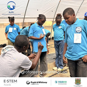 Project Lead explains soil prep to group of students
