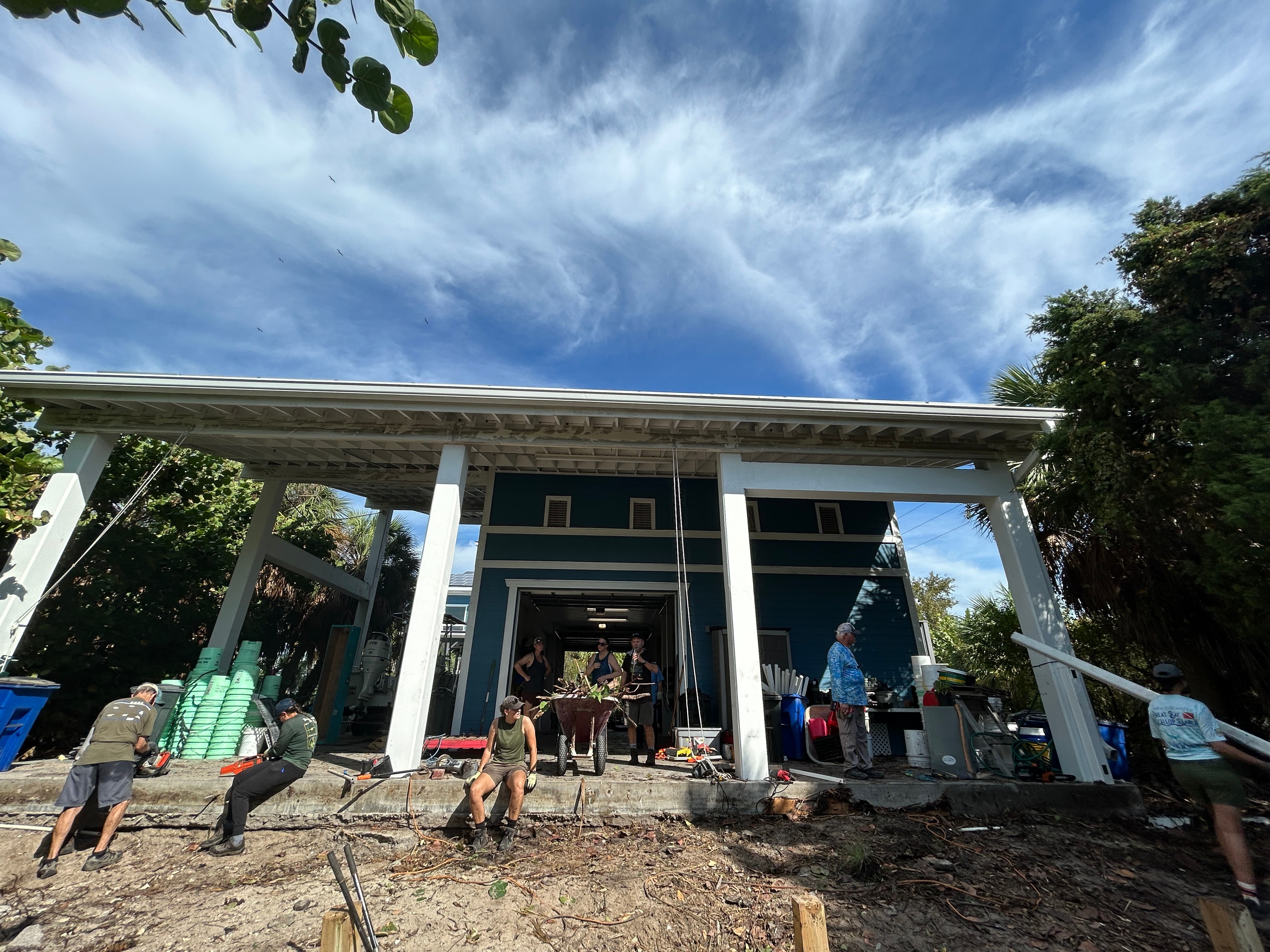 Staff working together to make repairs to building