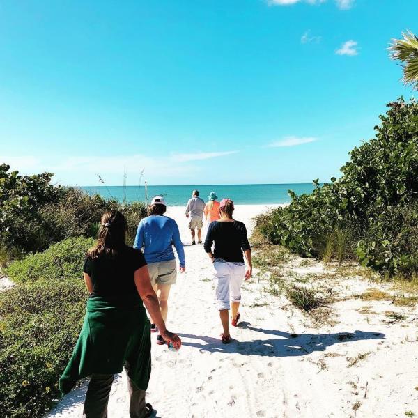 Educators from a previous program walk to onsite training at Keewaydin Island in Naples, Florida. Future WATERS participants will visit Keewaydin Island to record measurements and study how Florida coastlines are adapting to sea-level rise. Photo Credit: Dr. Heather Skaza Acosta