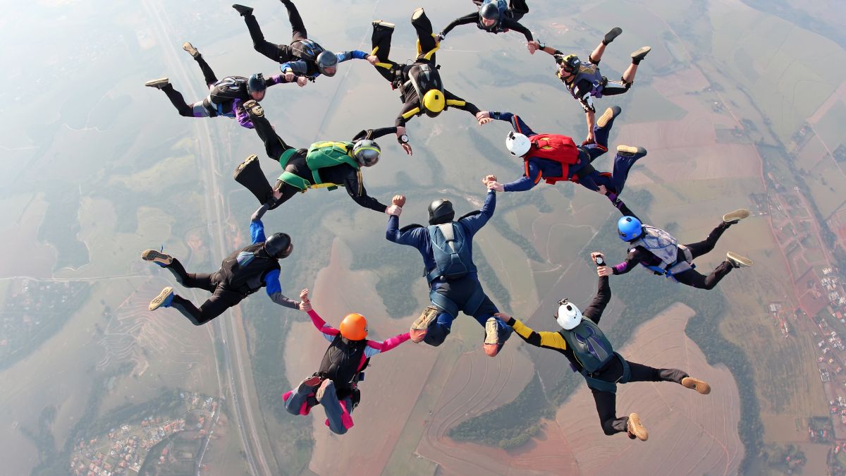 group of people skydiving in formation