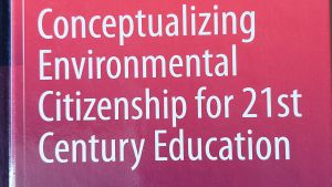 book cover, red and blue background with title "Conceptualizing Environmental Citizenship for 21st Century Education" on front