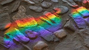 rainbow colors on grey cobblestone