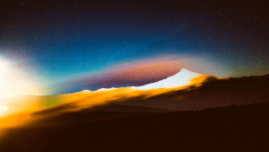 Abstract illustration of a mountain range with a bright light shining from the left