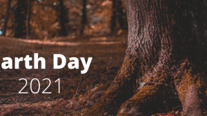 image of tree trunk and Earth Day 2021 in white type