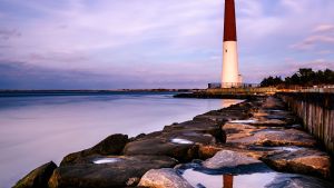 New Jersey lighthouse against purple sky and water