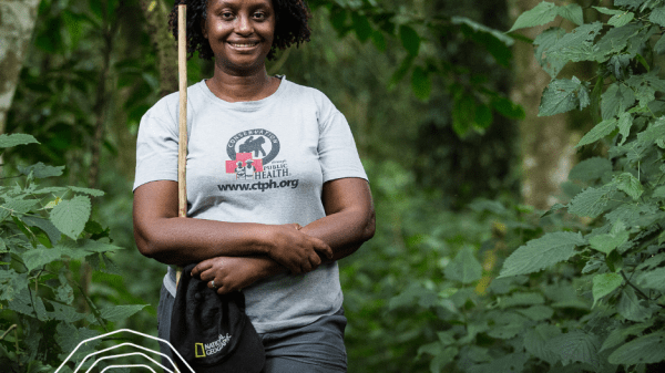 Person standing in forest. "Champions of the Earth"