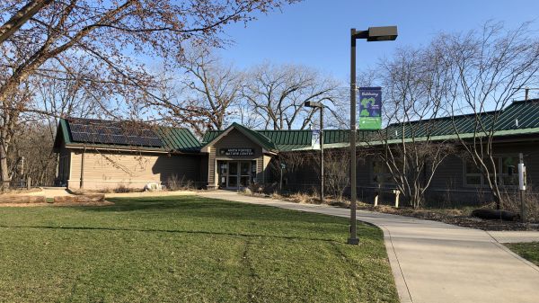 The entrance to Anita Purves Nature Center, where solar panels sit atop the building.
