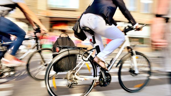People riding their bike in a city