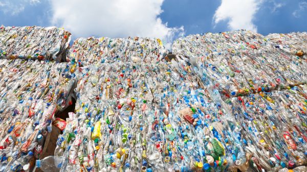 Gigantic bales of crushed plastics ready for recycling.
