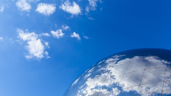 Fragment of the dome of the globe against the blue sky.