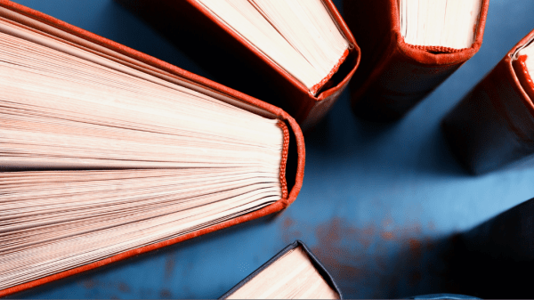 Photo of a ring of upright books with a gray border at the bottom with text that says, "eePRO/Higher Education Sep 23, 1 PM ET"