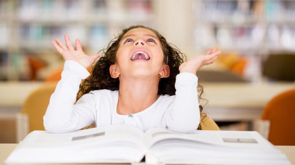 happy young student with book open