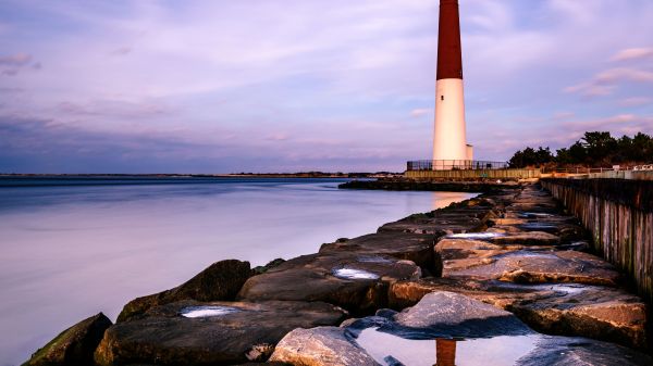 New Jersey lighthouse against purple sky and water