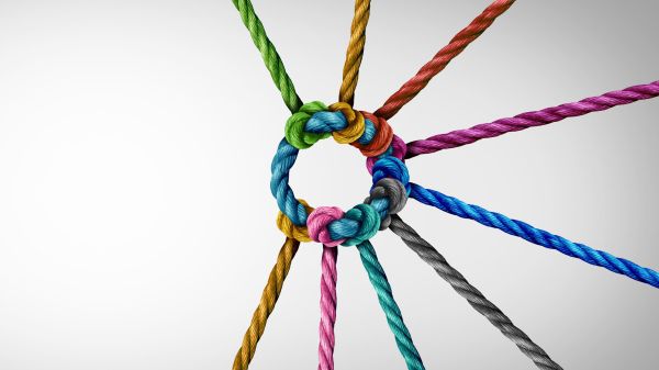 Colorful ropes woven together around a blue circle rope