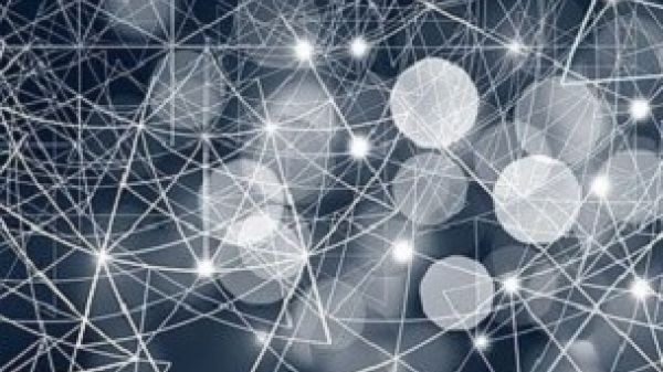 An abstract image of a network with white circles in bokeh style against a dark blue background