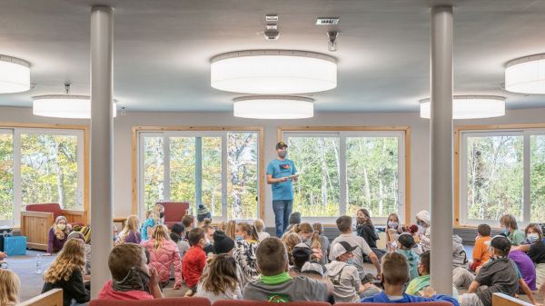 Cover of the journal: A group of children sits and looks at an adult in the middle of an open indoor space.   Text at top reads: "Directions — Journal of the Association of Nature Center Administrators // Winter 2022"  Text at bottom reads: "Innovation at Nature Centers / Director's Notes / Sustainable Construction / Pareidolia"
