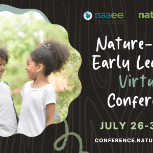 two young girls smiling outside in nature