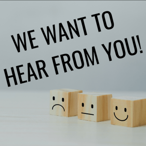Text reads "We Want to Hear from You!"; gray background with three wooden cubes with faces on them: one frowning, one neutral, one smiling