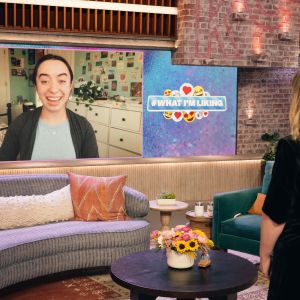 A smiling Audrey Noguera appears on large screen of set of The Kelly Clarkson Show