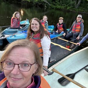 Picture of some participants from 2023 enjoying a peaceful paddle on the Saco River.