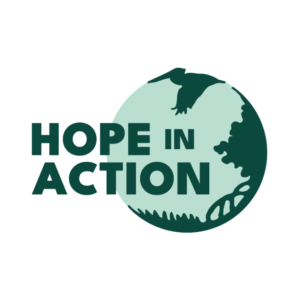 A logo that reads "HOPE IN ACTION" and shows grass, mangroves, and a pelican.