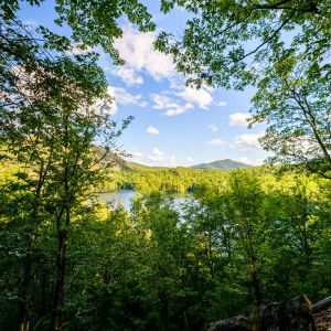 View of mountain and lake from the Adirondack forest at Pyramid Life Center.