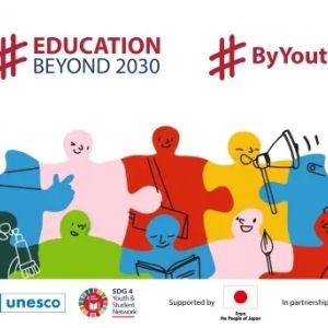 A graphic of illustrated puzzle pieces with smiling faces 