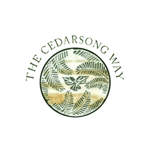 The words, 'The Cedarsong Way' are atop an image of sword fern fronds surrounding a trillium flower.