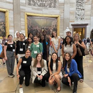 Group photo of the Young Changemakers Fellowship class of 2023–2024 inside the Capitol building.