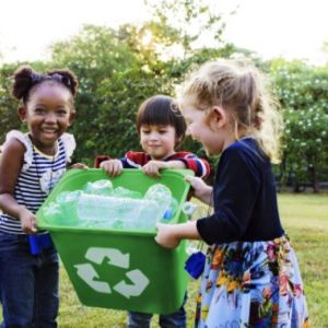 Three children recycling 