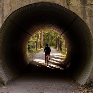 Bicyclist through a tunnel in Cuyahoga National Park.