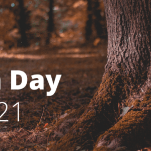image of tree trunk and Earth Day 2021 in white type