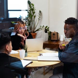 A group of co-workers of varying genders having a meeting