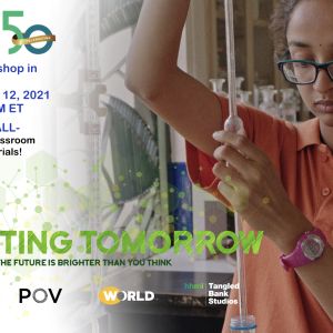 A scientist, wearing an orange shirt and standing in a laboratory, watches carefully as she holds a glass pipette over water bottle. 