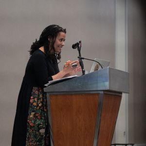 Dr. Carolyn Finney at a Podium