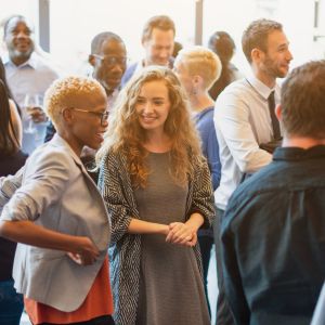 Group of people talking in a room.