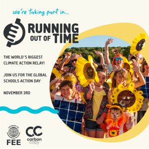 A group of children smile, holding oversized sunflower decorations. "We're taking part in Running Out of Time, the world's biggest climate action relay! Join us for the Global Schools Action Day, November 3rd"