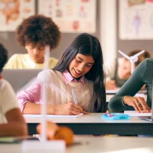 Group of students in a classroom studying wind turbines