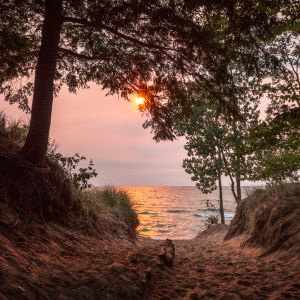 Sandy path towards Lake Michigan at sunset