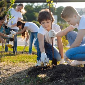 young students planting trees