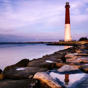 New Jersey lighthouse against purple sky and water
