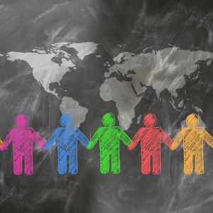 Graphic of chalkboard drawing of people holding hands around the world.
