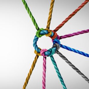 Colorful ropes woven together around a blue circle rope