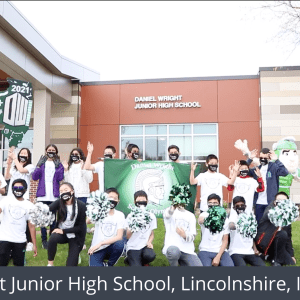 A group of students cheering outside in front of a school. White text at the bottom reads Daniel Wright Junior High School, Lincolnshire, IL